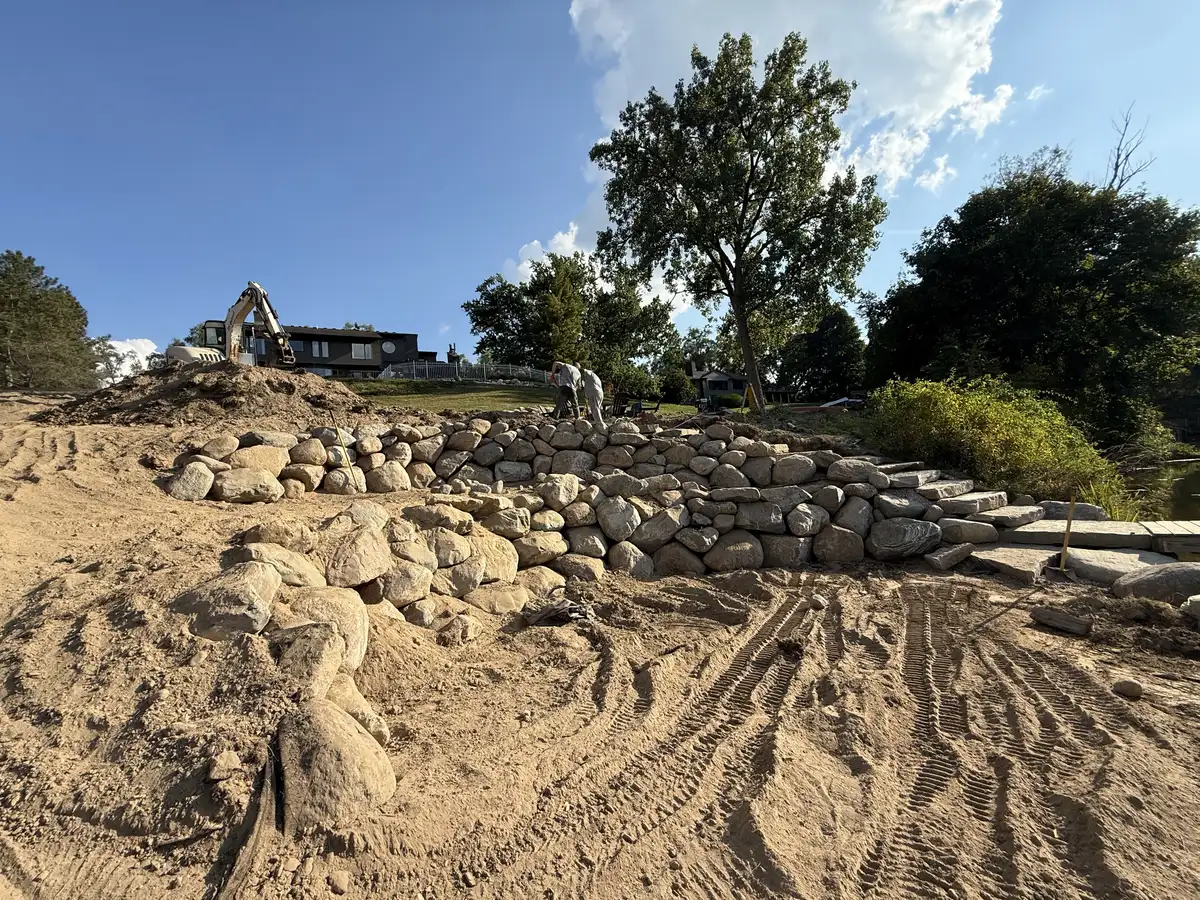 Lakefront stone steps and boulder wall in Michigan