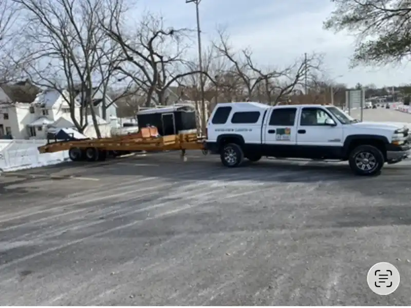 Earth Art Landscaping branded vehicle and crew